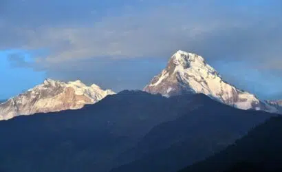 Majestic Annapurna Range glowing under the Himalayan sky – a breathtaking sight from the trekking trails of Nepal.